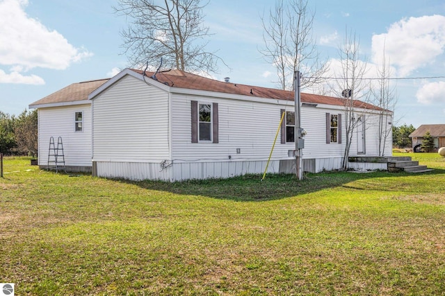 back of property with a yard
