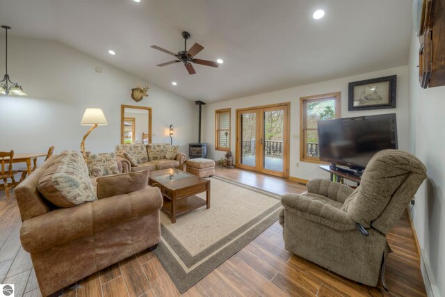 living area with ceiling fan, vaulted ceiling, recessed lighting, and wood finished floors