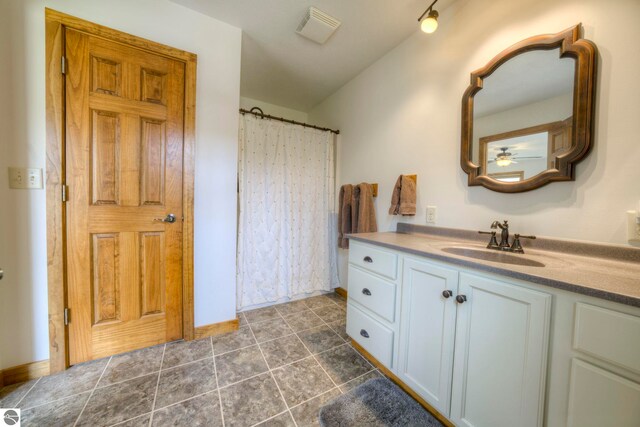 full bathroom with a ceiling fan, visible vents, vanity, tile patterned floors, and a shower with shower curtain