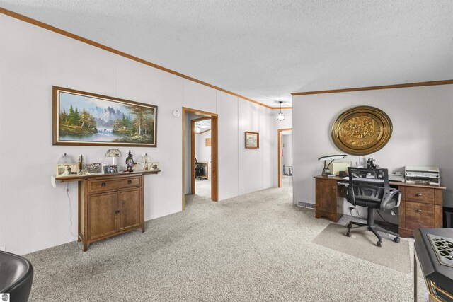 office featuring crown molding, a textured ceiling, and light carpet