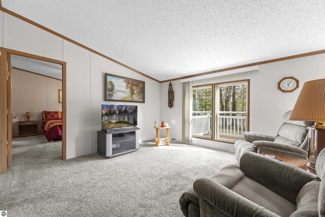 carpeted living area with crown molding, a textured ceiling, and lofted ceiling