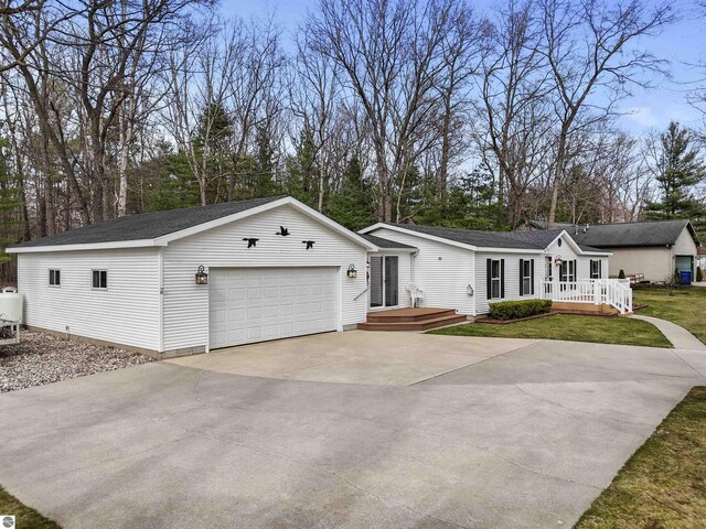 view of front of house with a deck and roof with shingles
