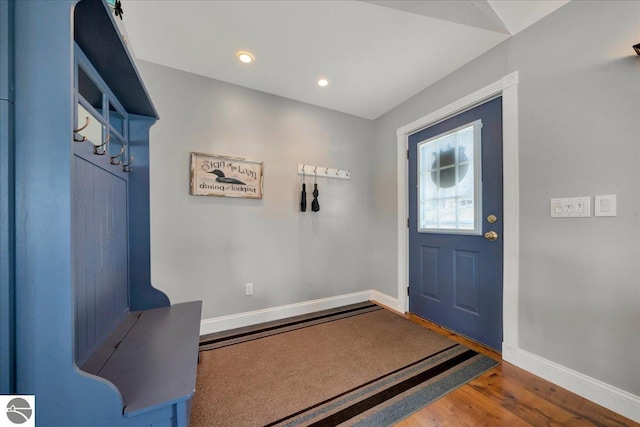 foyer featuring baseboards, recessed lighting, and wood finished floors