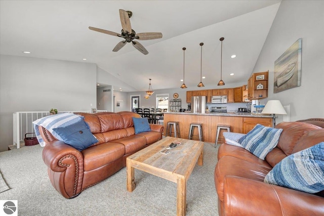 living area featuring recessed lighting, a ceiling fan, vaulted ceiling, and light carpet