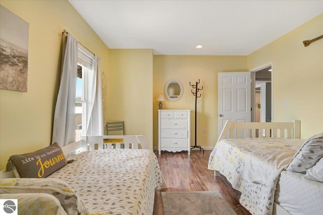 bedroom featuring baseboards, recessed lighting, and dark wood finished floors
