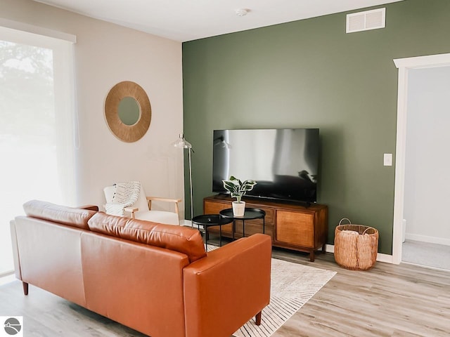 630 S Garfield Ave Unit 108, Traverse City, MI 49686 - living area featuring visible vents, light wood-style floors, and baseboards