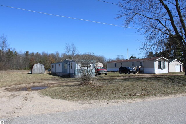 20122 Hayes Rd, Big Rapids, MI 49307 - exterior space with an outdoor structure and a shed