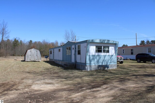 20122 Hayes Rd, Big Rapids, MI 49307 - view of front of property with a storage shed and an outbuilding