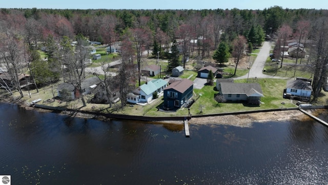 bird's eye view featuring a water view and a view of trees