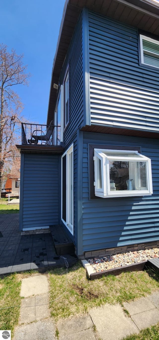 view of property exterior with a patio