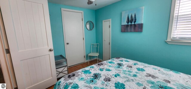 bedroom with a ceiling fan and wood finished floors