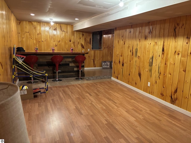 3633 Driftwood Dr, Cadillac, MI 49601 - finished below grade area with baseboards, wood walls, and wood finished floors