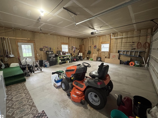 3633 Driftwood Dr, Cadillac, MI 49601 - garage featuring a workshop area and a garage door opener