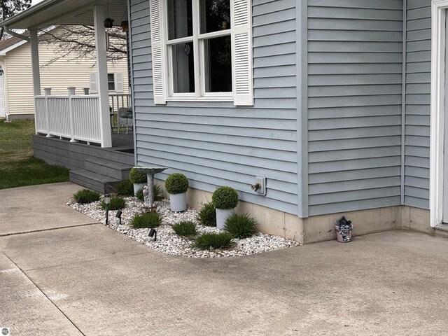 3633 Driftwood Dr, Cadillac, MI 49601 - view of home's exterior featuring a patio