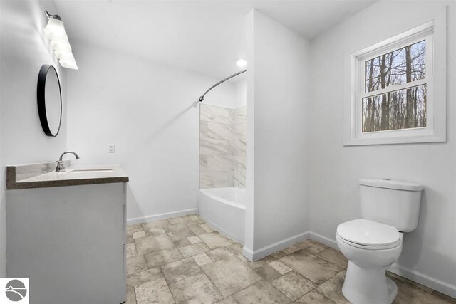4326 Antioch Dr, Mesick, MI 49668 - full bath featuring shower / bath combination, stone finish floor, baseboards, vanity, and toilet