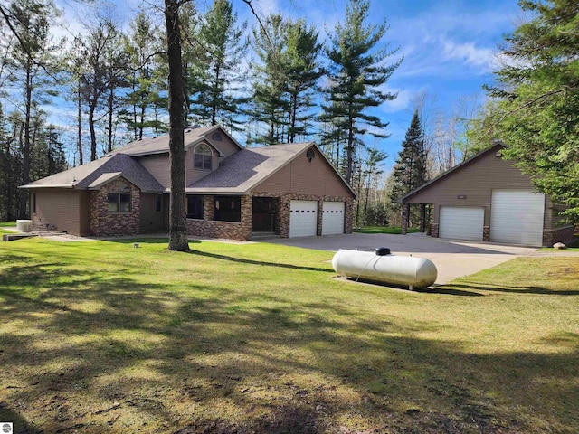 1697 Wildwood Rd, Sterling, MI 48659 - view of front of house with a front yard, stone siding, and a garage