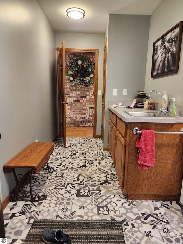 1697 Wildwood Rd, Sterling, MI 48659 - corridor with a sink, light floors, and baseboards