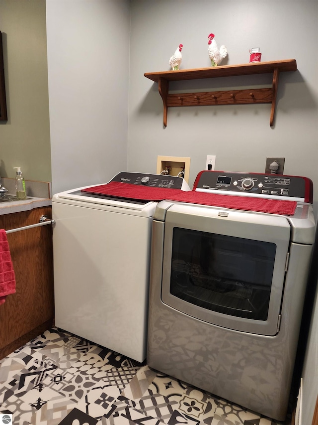 1697 Wildwood Rd, Sterling, MI 48659 - clothes washing area with laundry area and washer and dryer