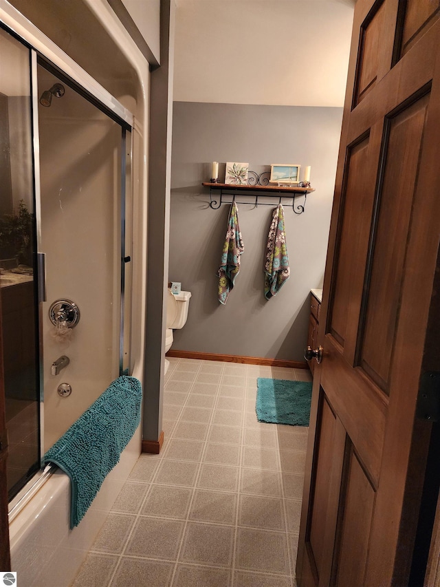 1697 Wildwood Rd, Sterling, MI 48659 - full bathroom featuring tile patterned floors, toilet, and shower / bath combination with glass door