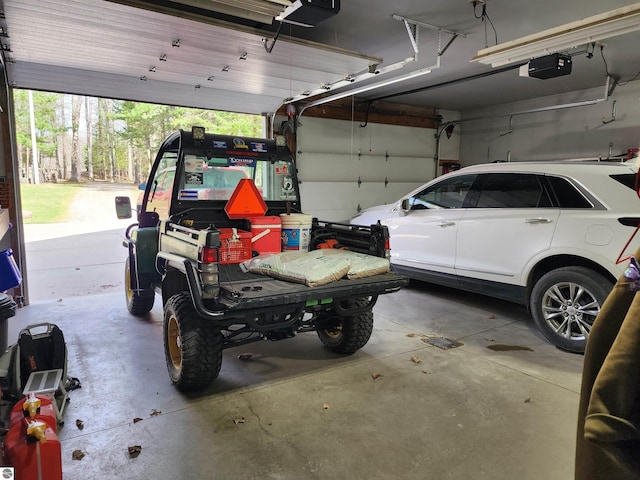 1697 Wildwood Rd, Sterling, MI 48659 - garage with a garage door opener