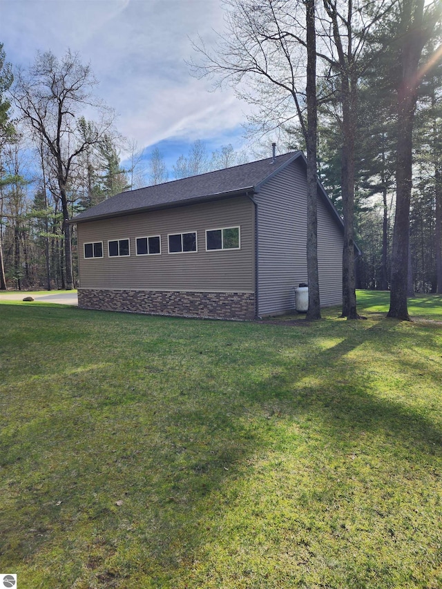 1697 Wildwood Rd, Sterling, MI 48659 - view of side of property featuring a yard
