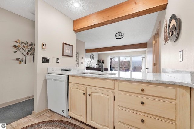 kitchen with a peninsula, light stone countertops, white dishwasher, a textured ceiling, and a sink