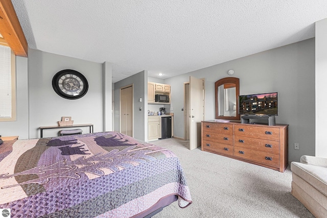 bedroom featuring a textured ceiling, light carpet, and indoor bar