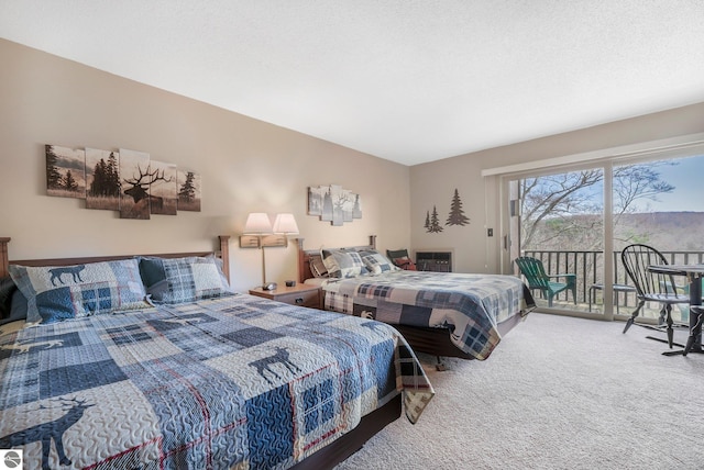 bedroom featuring carpet flooring and access to exterior