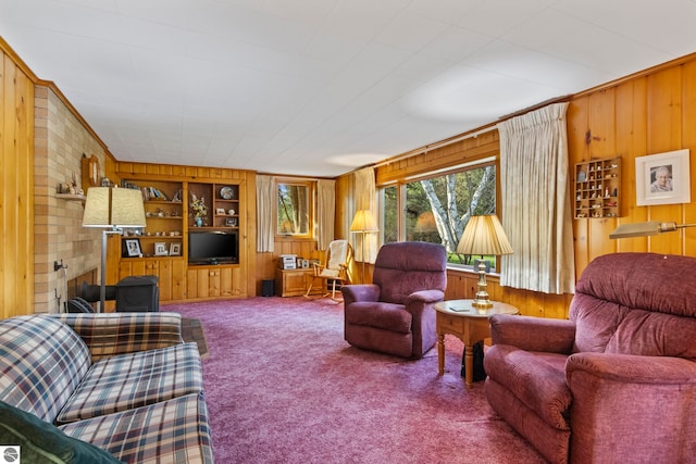 living room featuring wooden walls, built in features, ornamental molding, and carpet floors