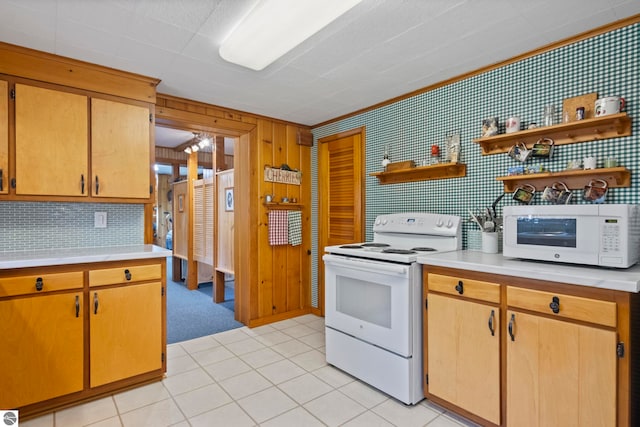kitchen featuring open shelves, light tile patterned floors, white appliances, and light countertops