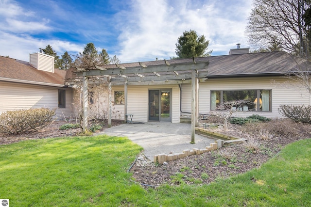 back of house with a patio area, a yard, and a pergola