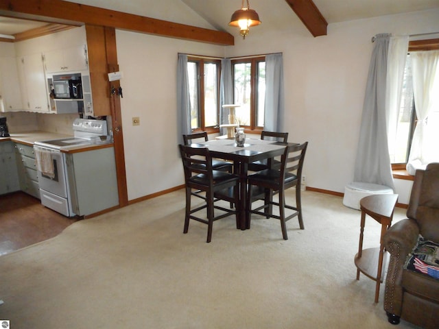 dining space featuring baseboards, vaulted ceiling with beams, and light colored carpet