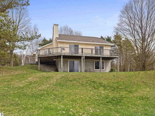 8377 Orchard Hill Rd, Beulah, MI 49617 - back of house with a lawn, a deck, and a chimney