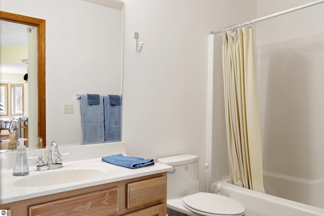 8377 Orchard Hill Rd, Beulah, MI 49617 - bathroom featuring toilet, shower / bathtub combination with curtain, and vanity