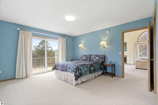8377 Orchard Hill Rd, Beulah, MI 49617 - bedroom with access to outside, baseboards, and carpet floors