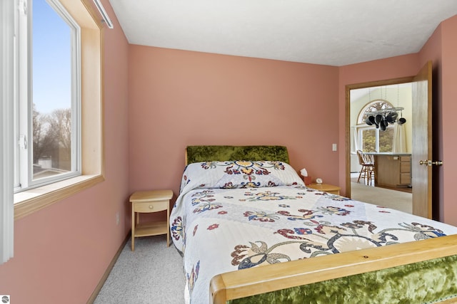 8377 Orchard Hill Rd, Beulah, MI 49617 - bedroom with baseboards and light colored carpet