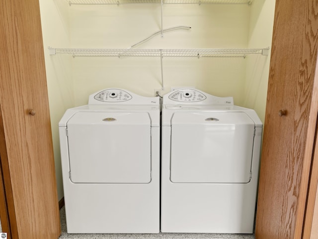 8377 Orchard Hill Rd, Beulah, MI 49617 - clothes washing area with separate washer and dryer and laundry area