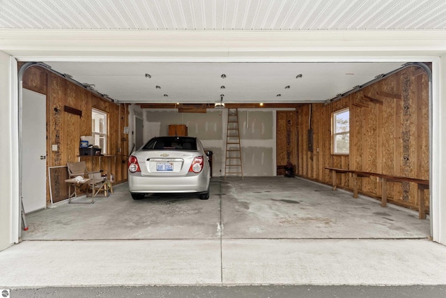 8377 Orchard Hill Rd, Beulah, MI 49617 - garage with wooden walls