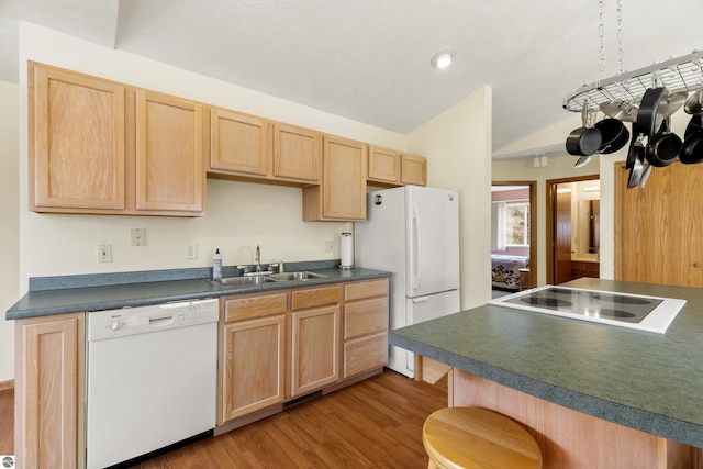 8377 Orchard Hill Rd, Beulah, MI 49617 - kitchen featuring a sink, light brown cabinets, white appliances, wood finished floors, and vaulted ceiling