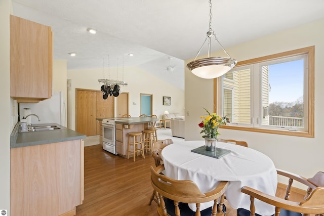 8377 Orchard Hill Rd, Beulah, MI 49617 - dining space featuring wood finished floors and lofted ceiling