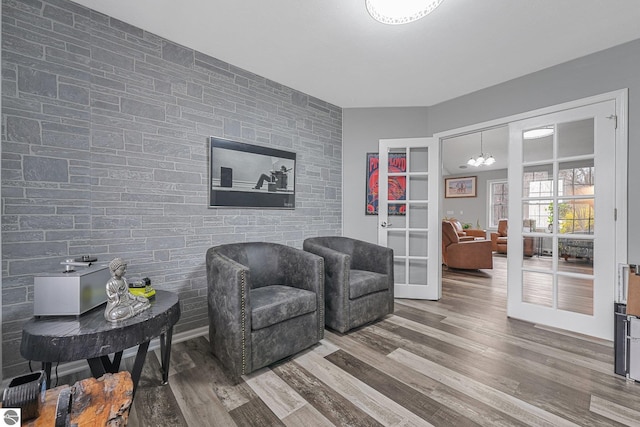 living area featuring french doors and wood finished floors