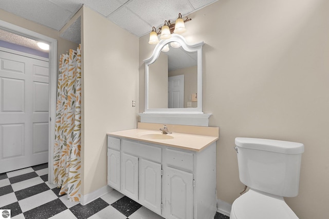 full bath featuring toilet, tile patterned floors, baseboards, and vanity