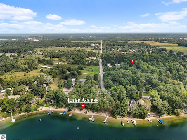 aerial view featuring a water view and a forest view