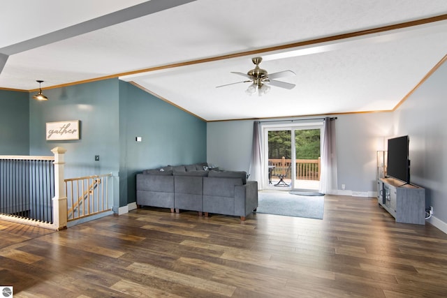 living area with baseboards, ceiling fan, vaulted ceiling with beams, and wood finished floors