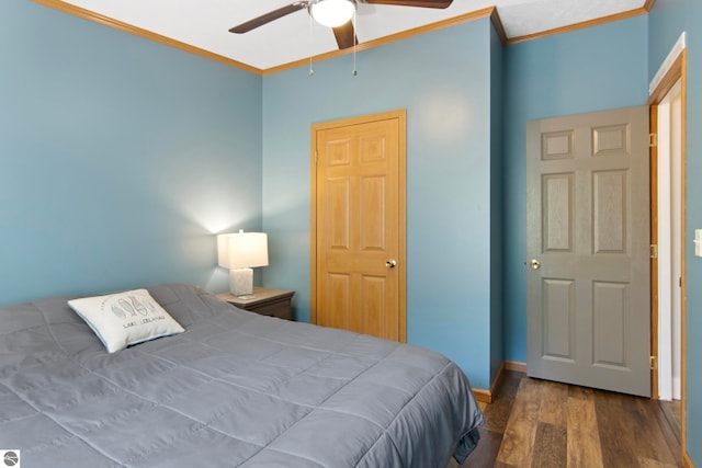bedroom featuring a ceiling fan, baseboards, ornamental molding, and wood finished floors