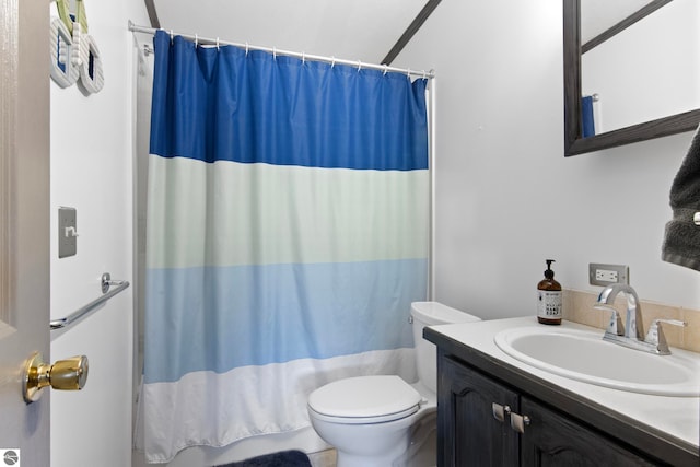 full bathroom with toilet and vanity