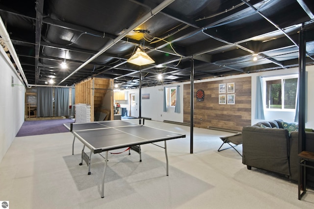 game room featuring wood walls