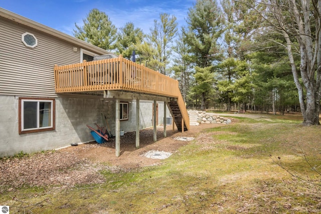view of yard with a wooden deck and stairway