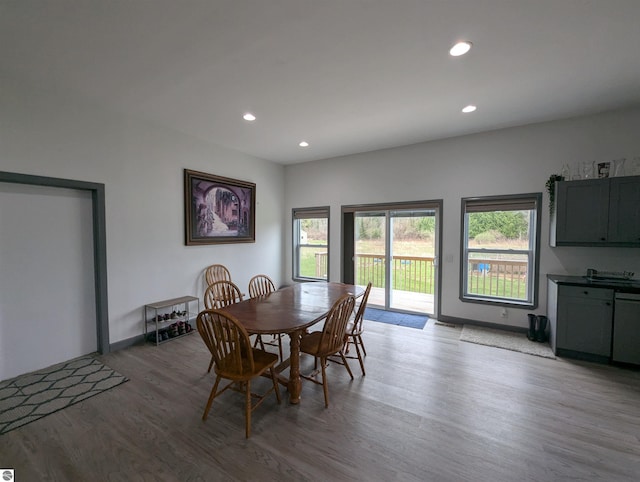 dining space with recessed lighting and wood finished floors