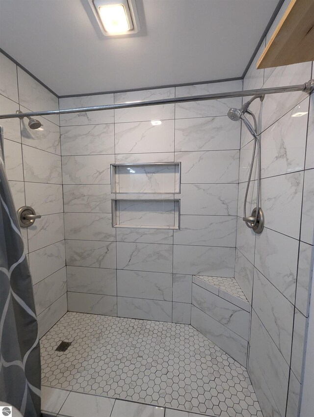 full bath featuring a shower stall